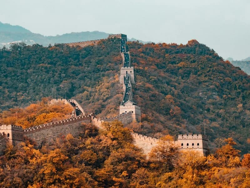 The Great Wall near Beijing surrounded by autumn foliage