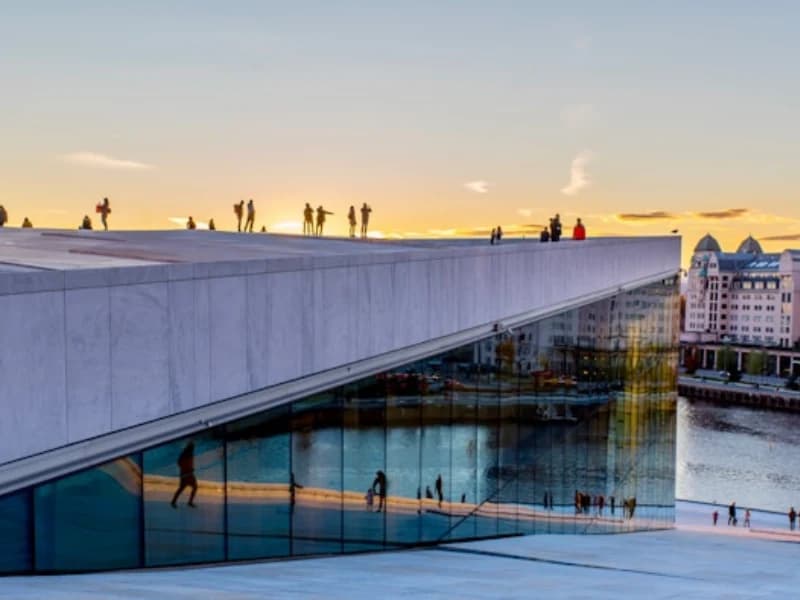 Oslo Opera House overlooking the waterfront at sunset